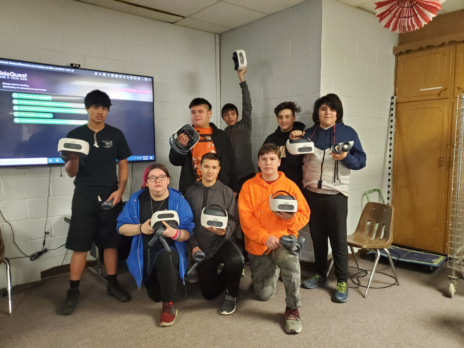 Virtual World Society community members using VR headsets